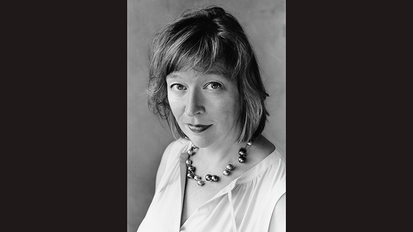 black and white headshot of Jennifer Grotz in loose shirt and beaded necklace