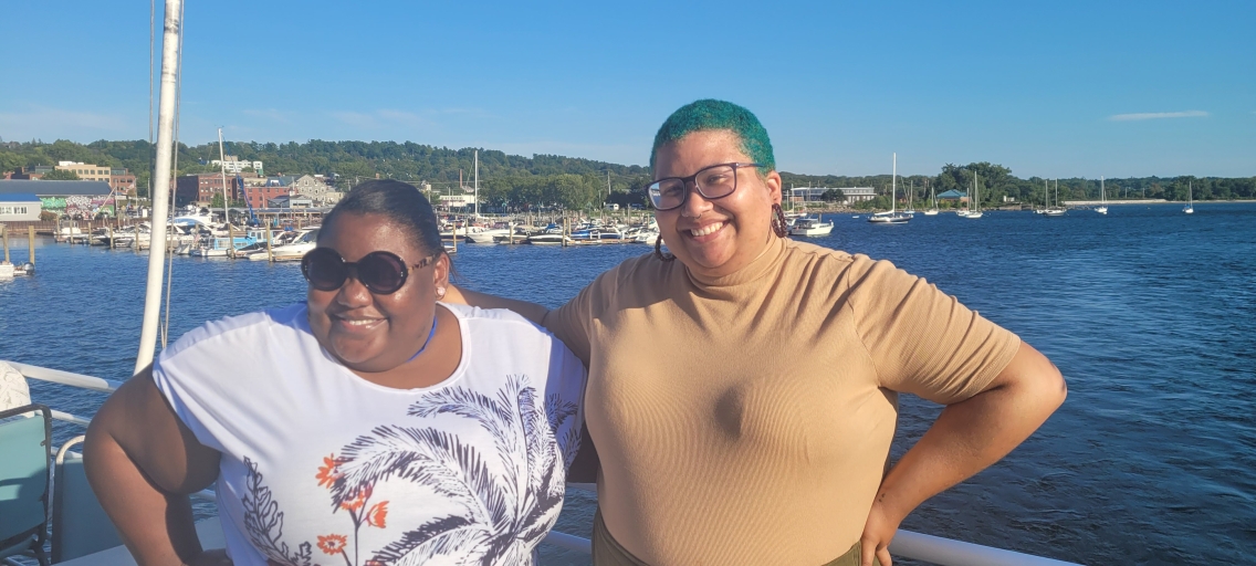 Photo of AFC professional staff on a boat on Lake Champlain