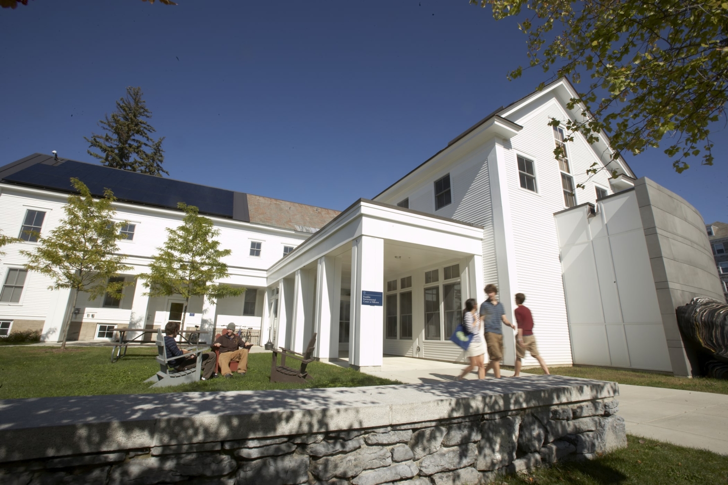 The Franklin Environmental Center at Hillcrest sits in the sun with trees around the building