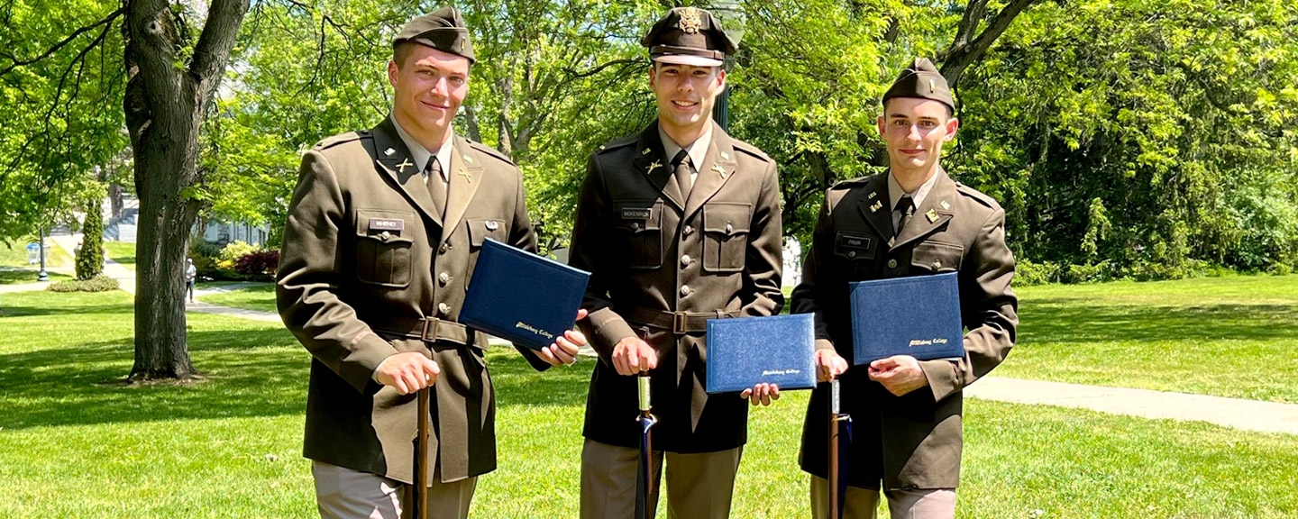 Aidan McKenrick ’23, Corey Prior ’23, and Ryan Whitney ’23 (commissioned Army 2nd Lieutenant May 21, standing with their diplomas and their Painter's Cane. Graduation May 28, 2023.