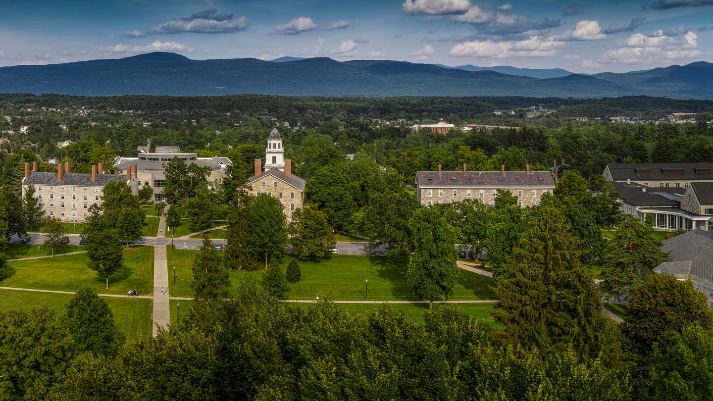 Panoramic view of campus with the Green Mountains and beyond in the distance.