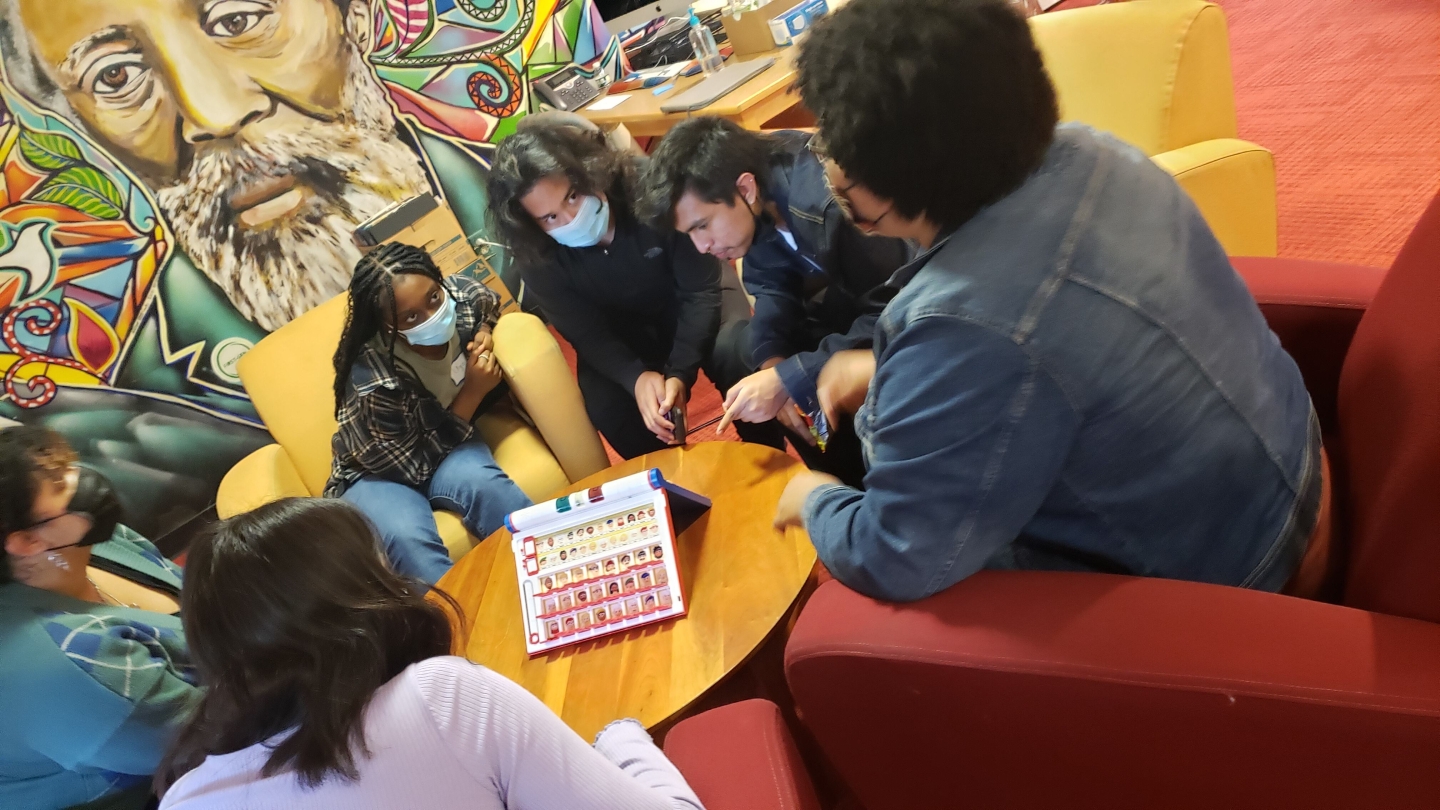 Students and AFC Assistant Director enjoy games together