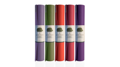 a variety of rolled up yoga mats, each with a label saying "Jade Yoga"