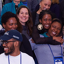 a group of Black, Indigenous and People of Color alumni smiling at a 2018 gathering