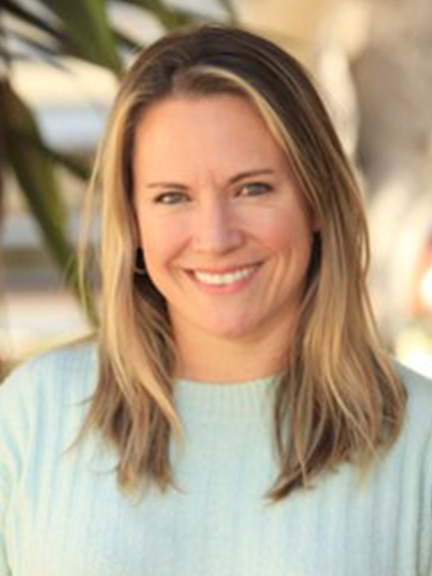 Portrait of Allie Ladio in a mint green sweater.