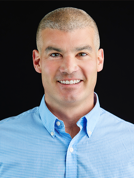 Portrait of Joe Porter wearing a blue shirt.