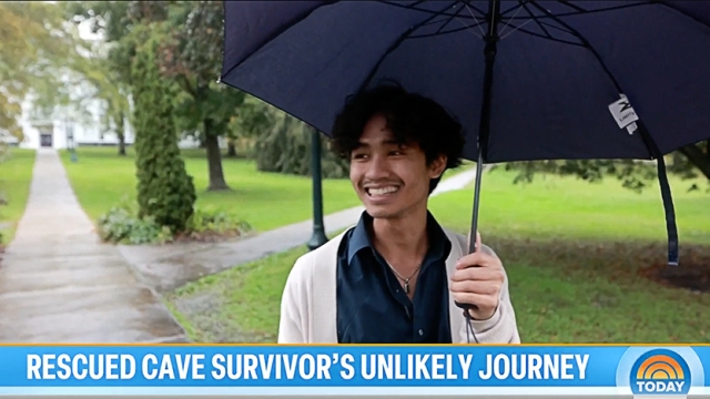 Adul Samon ’27 holding an umbrella on the Middlebury Campus