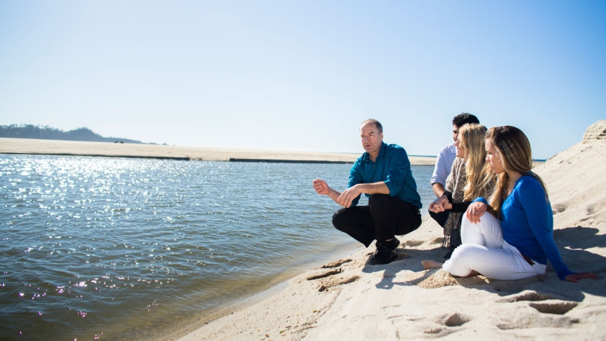Professor Langholz teaches and environmental policy class at the beach's shoreline.