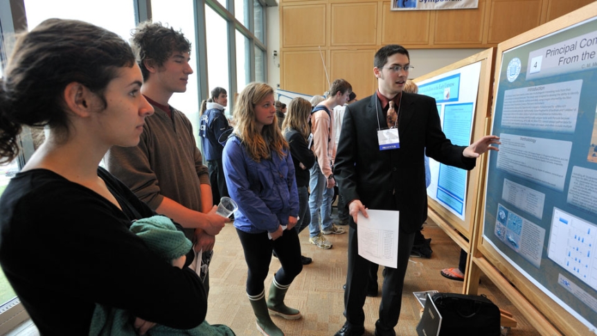 A student presents his research during the Spring Student Symposium.