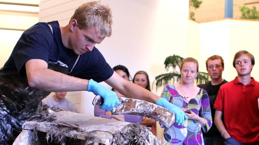 Students participate in a parchment making workshop.