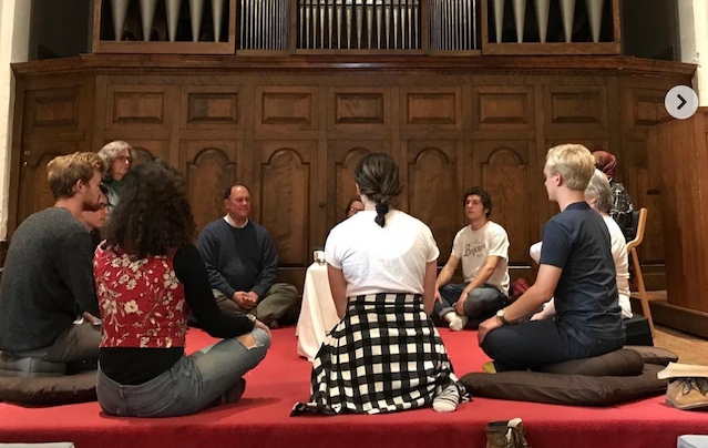 seated group of people in mediation