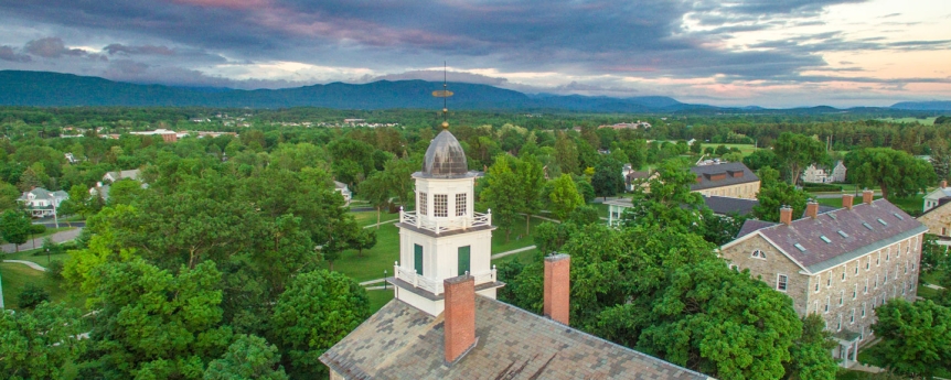 Aerial view of campus looking toward the Green Mountains with Old Chapel in the foreground.