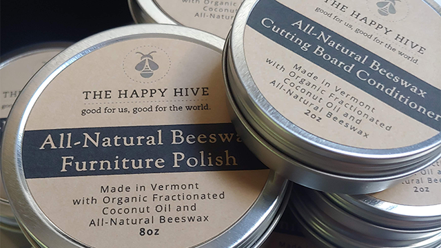 Canisters of beeswax polish