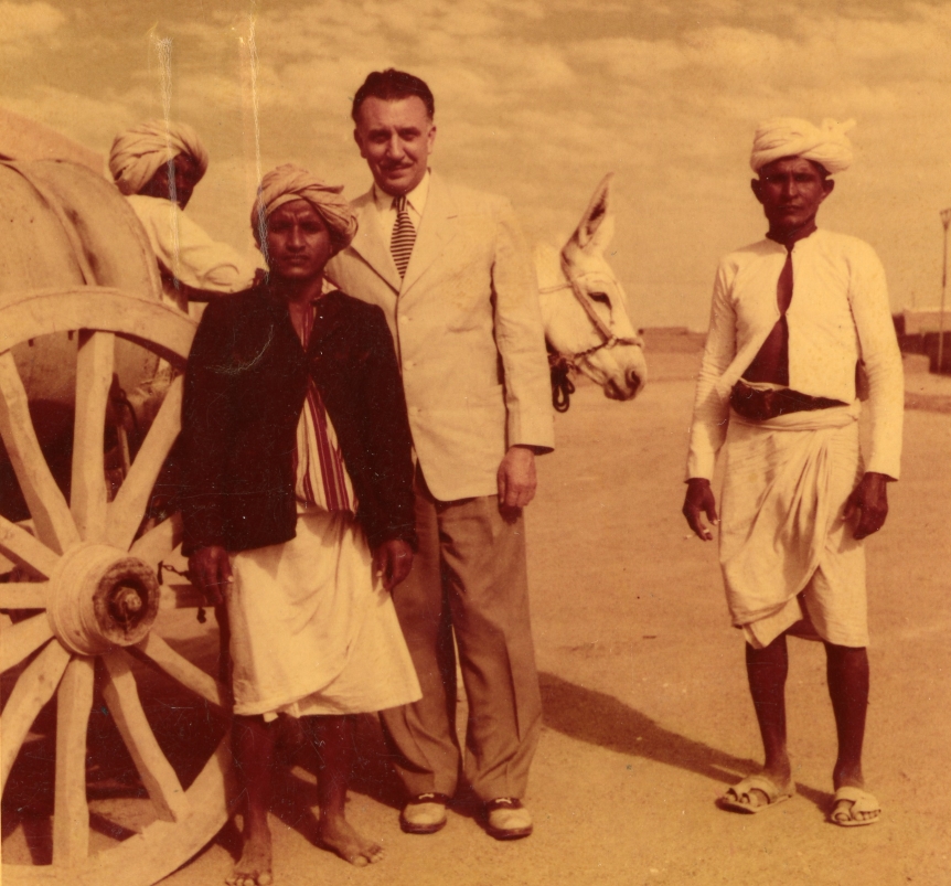 Middlebury College President Samuel Stratton poses in front of a mule-drawn cart on a visit to Saudi Arabia in the 1960s