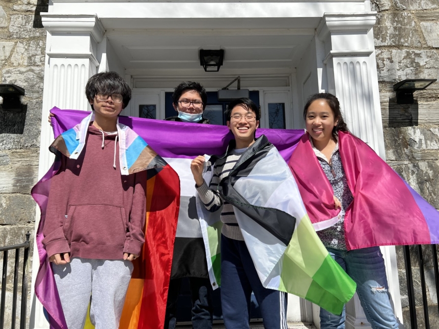 Group of students on the steps of Carr Hall during Pride Week