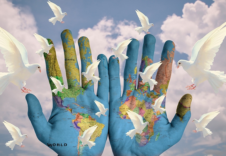 Illustration of hands with print of the world on them, palms facing forward, with doves flying around.