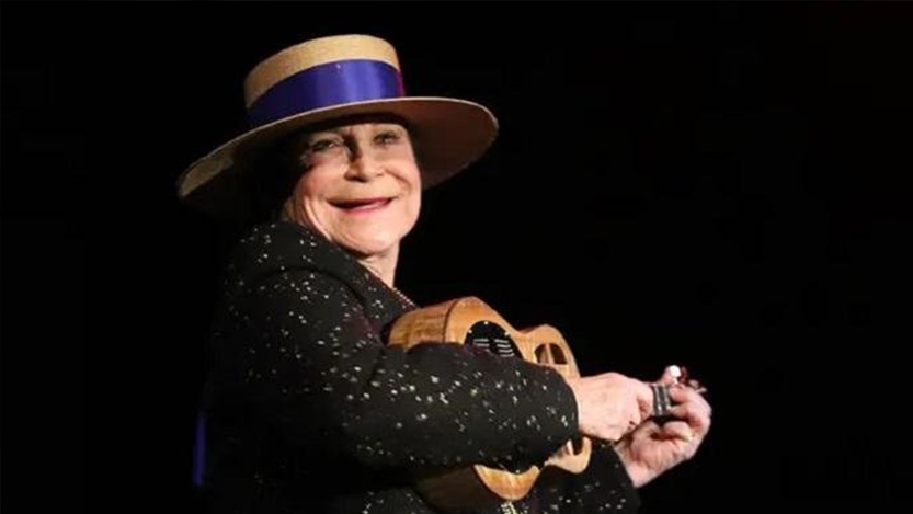 Diana Shulman ’56 playing a ukulele