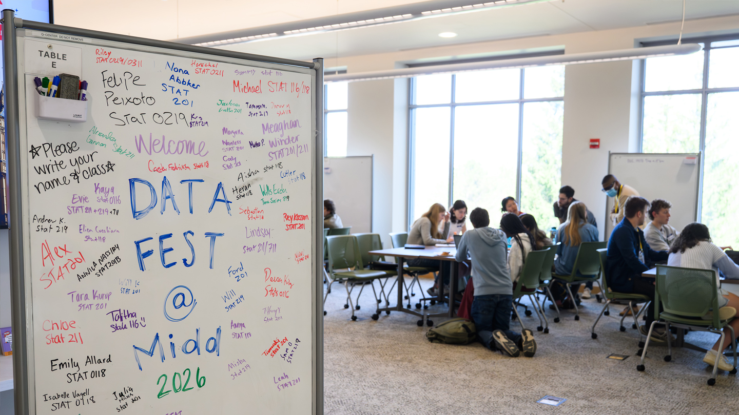 A whiteboard sign welcomes students to DataFest.