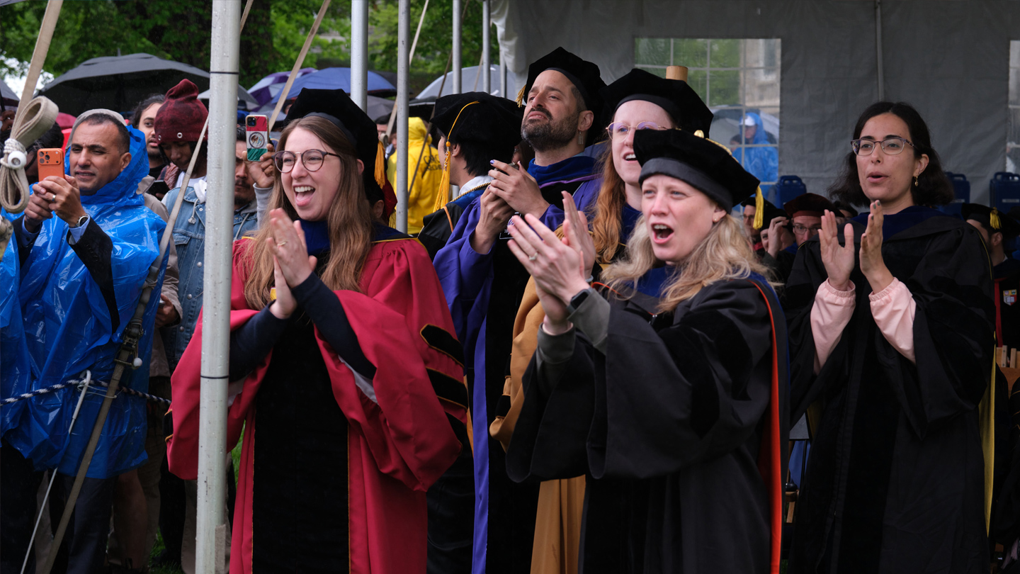 Middlebury faculty members cheer for the graduating students.
