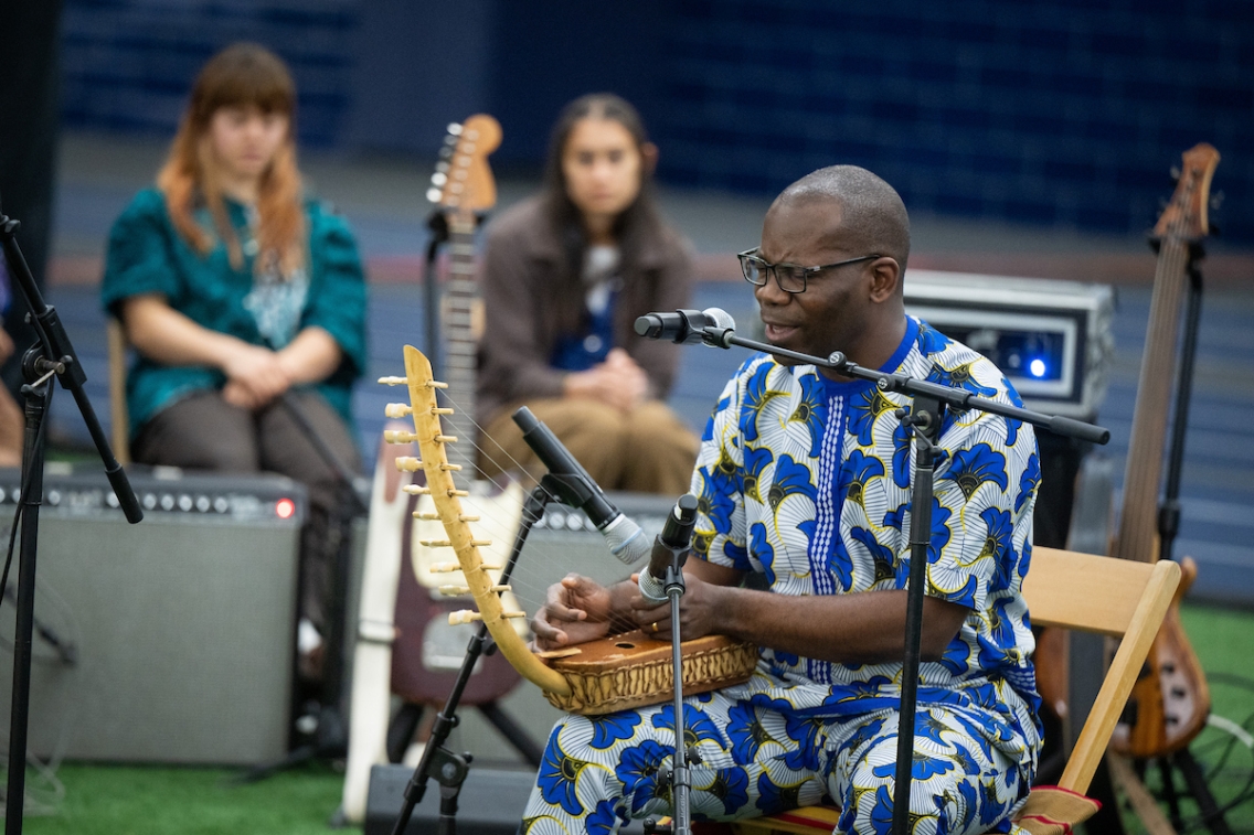Professor Damascus Kafumbe performing on the adungu.