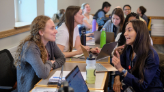 Students at the Middlebury Language Schools converse in a classroom.