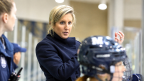 Coach Emily McNamara at a Middlebury women's hockey game.
