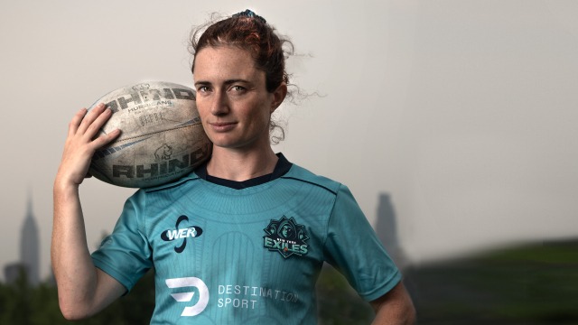 Professional rugby player Sarah Minahan '14 posing before NYC skyline