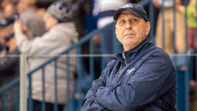 Coach Bill Mandigo at a hockey game at Kenyon Arena.
