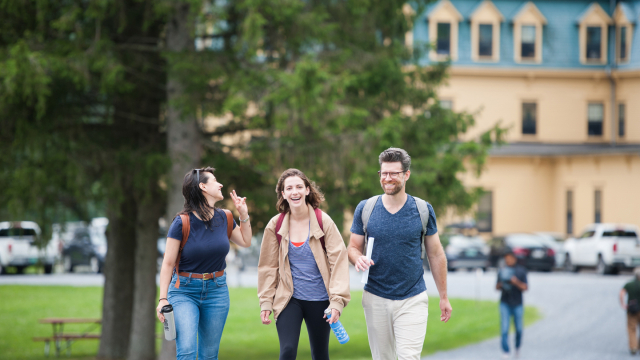 Students and instructors walk across the Middlebury Bread Loaf campus in Ripton, Vermont