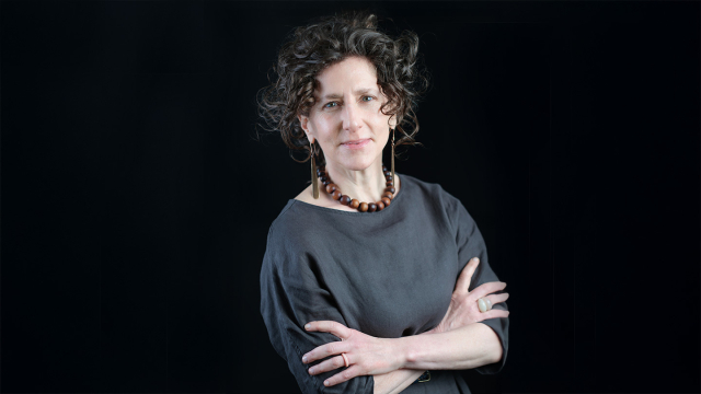 Photo of Rebekah Irwin in front of a black background
