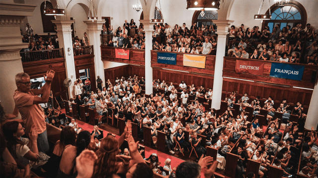 View of Middlebury Chapel from the balcony, filled with Language Schools students at their convocation.