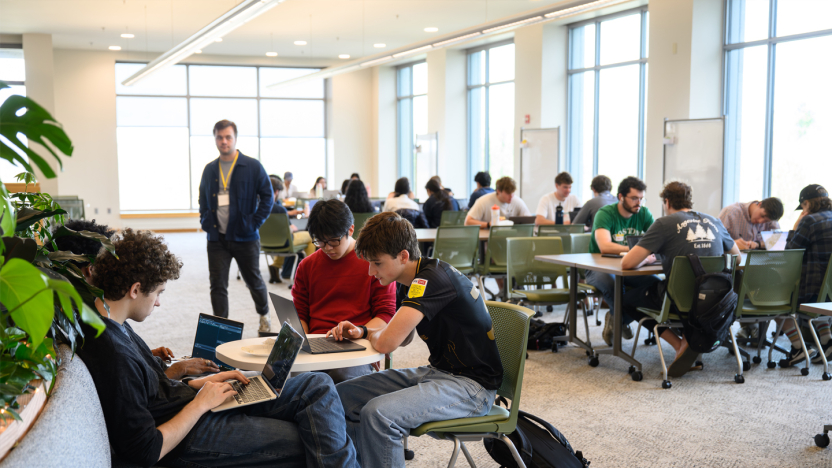 Students work on a project together at the Q Center.