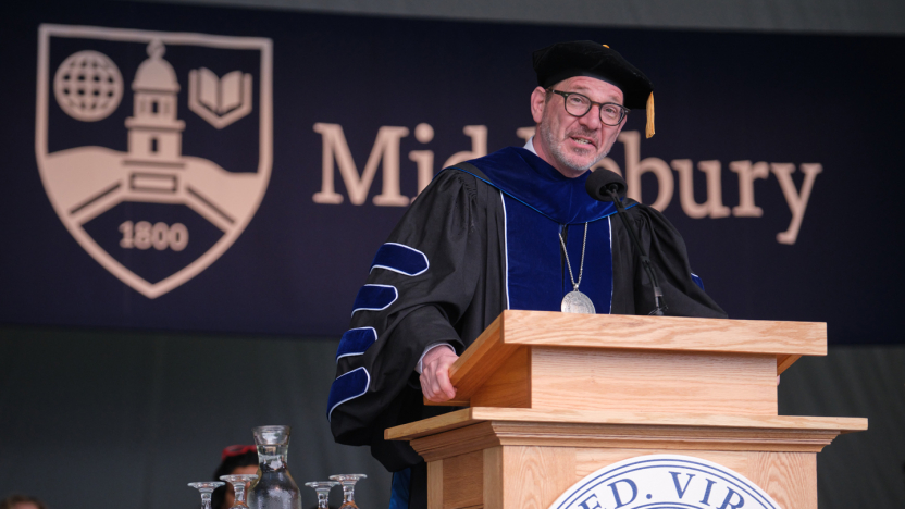 President Ian Baucom at podium