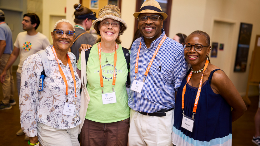 Four Middlebury Reunion attendees pose for a photo with arms around each other.