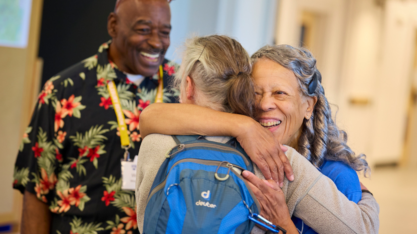 Two people hug at Middlebury College Reunion.