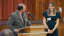 Two people pose for a photo during an awards ceremony.