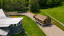An ariel view of the historic Hubbard log cabin at the Middlebury College Snowbowl being moved to its new location near Starr Lodge.