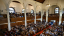 An overhead shot inside a chapel with pews filled with students.