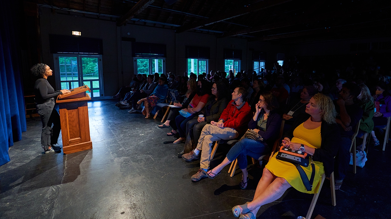 Faculty member Tarfia Faizullah reads in the Little Theater on the Bread Loaf campus.