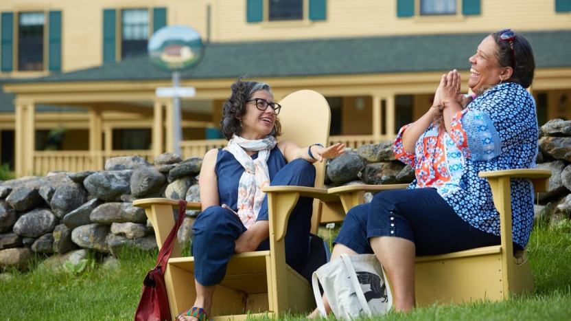 Vicki Vertiz talks with Faculty member Amber Flora Thomas