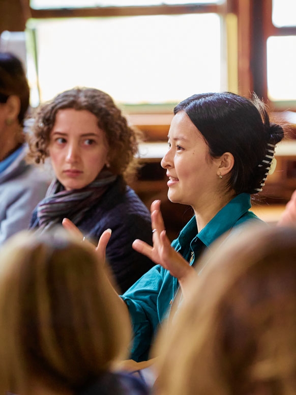 Students attending a lecture in the Barn participate during the question and answer session.